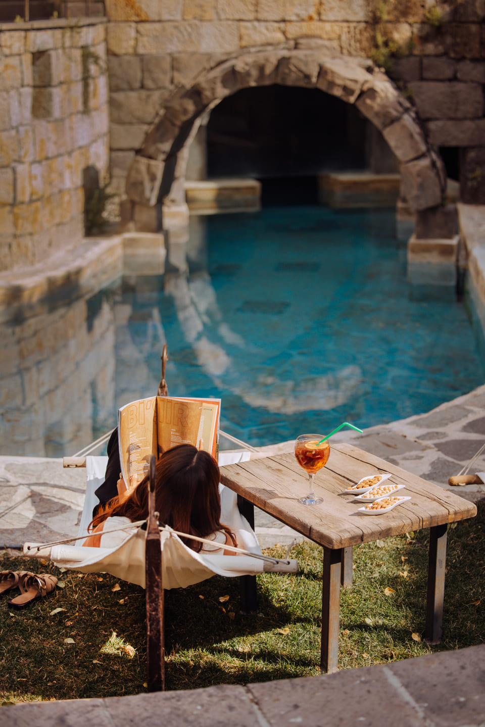 Reading by the open-air pool