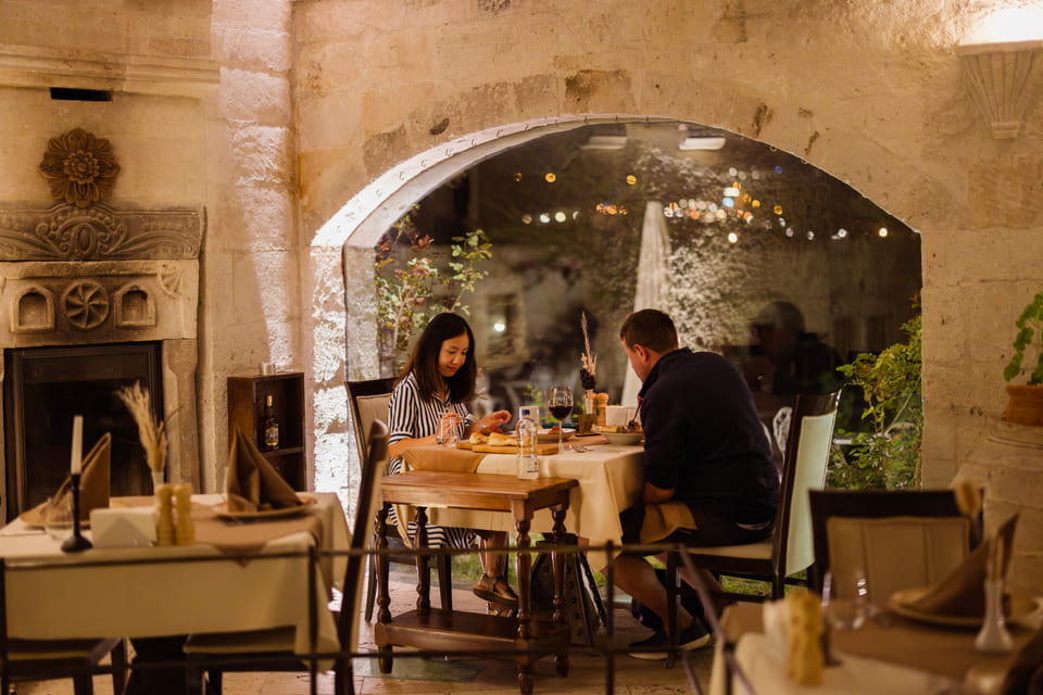 Dinner at a table beside the fireplace