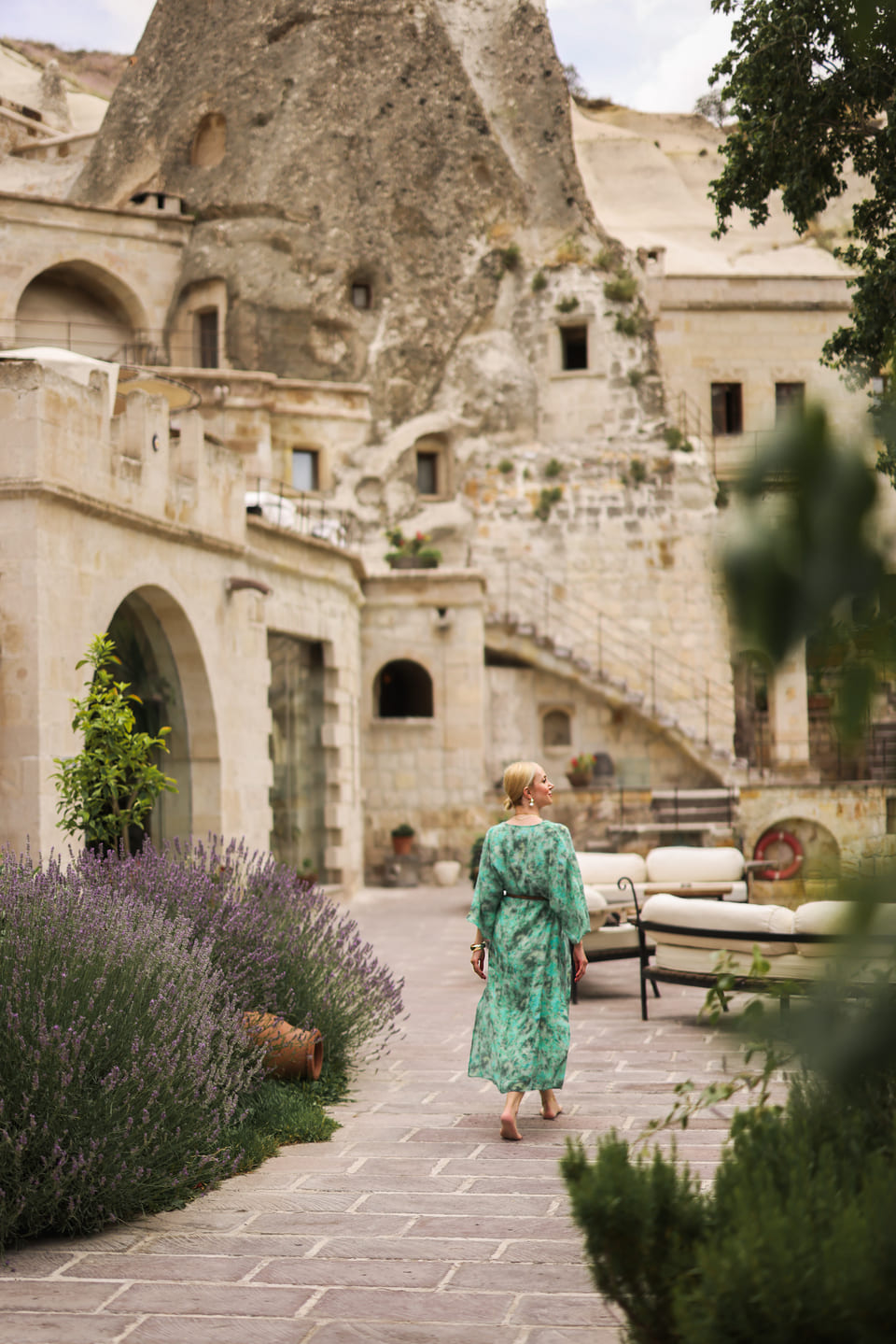 The garden path between the lavender and the cave facades