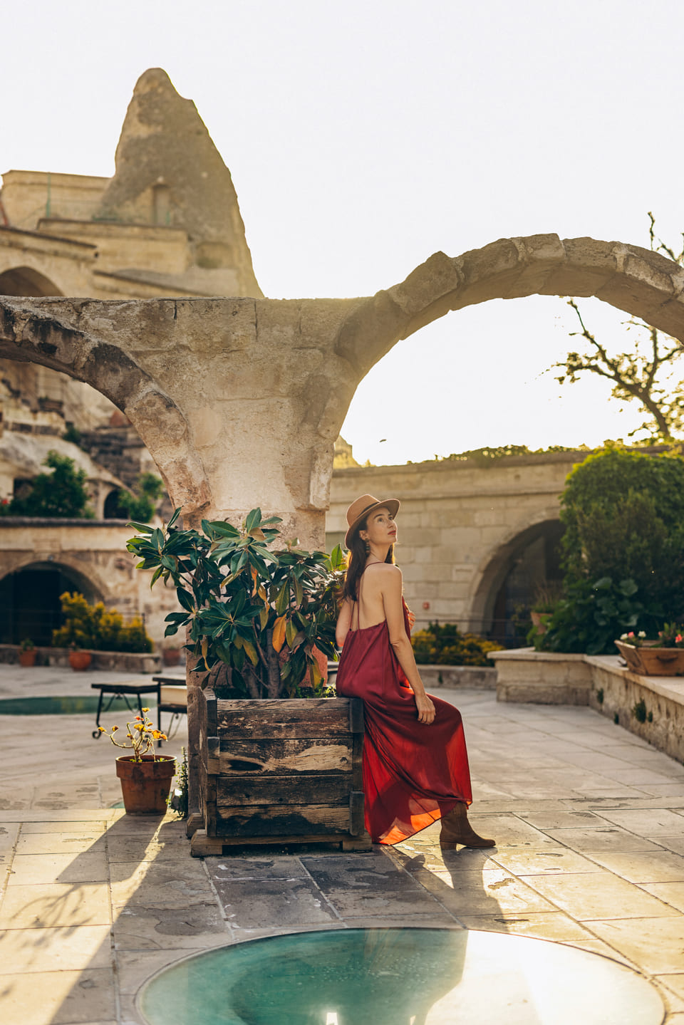 Under the arch beside the pool